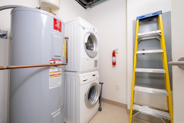 300 Third Unit 708, Little Rock, AR 72201 - laundry room with stacked washer and clothes dryer, electric water heater, and baseboards
