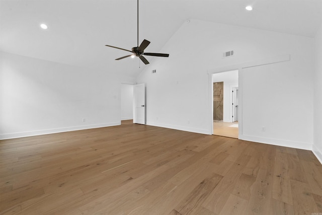 unfurnished living room featuring high vaulted ceiling, ceiling fan, and light wood-type flooring