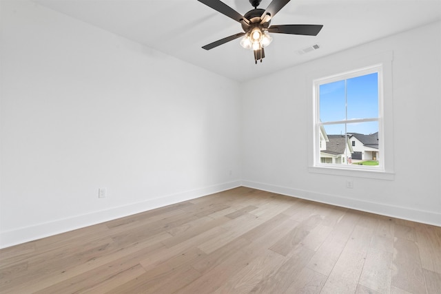 spare room featuring ceiling fan and light wood-type flooring