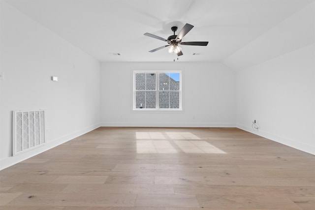 unfurnished room featuring lofted ceiling, ceiling fan, and light hardwood / wood-style flooring