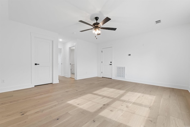 empty room with light hardwood / wood-style floors and ceiling fan