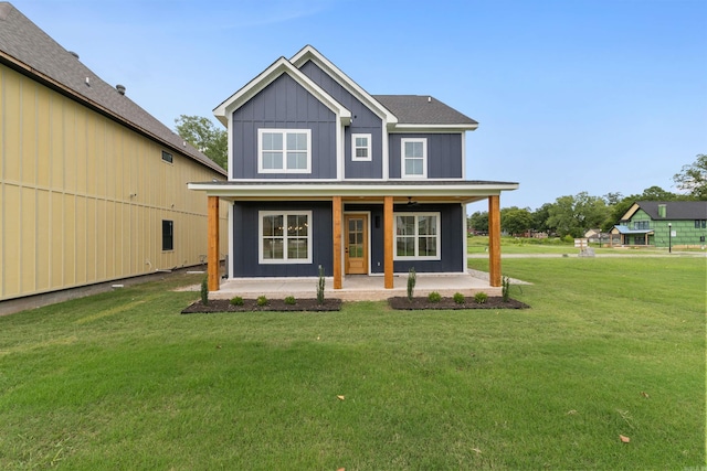 view of front of house with a front yard and covered porch