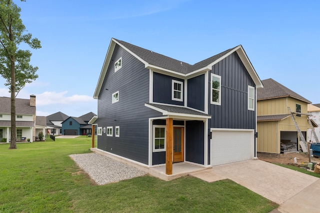 view of front of house featuring a garage and a front yard