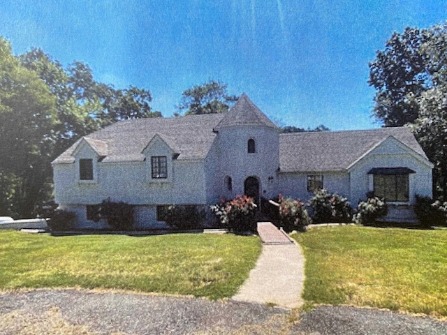 french country home with a front yard