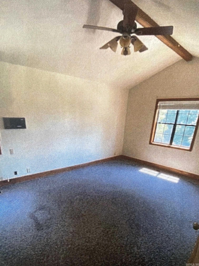 interior space with lofted ceiling with beams and ceiling fan