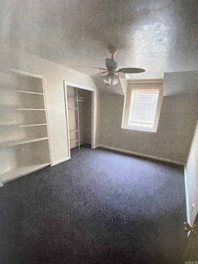 unfurnished bedroom featuring carpet floors, ceiling fan, and a closet