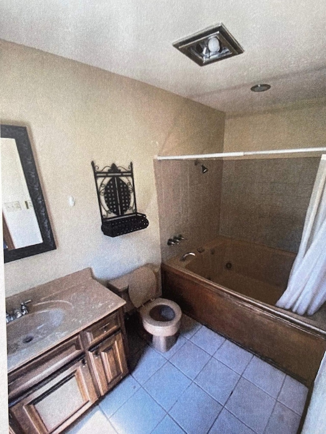 full bathroom with vanity, shower / bath combo, tile patterned floors, and toilet