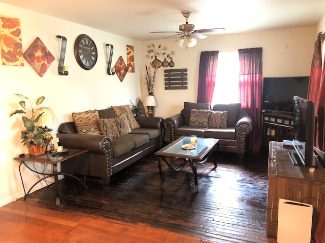 living room featuring ceiling fan and dark hardwood / wood-style floors