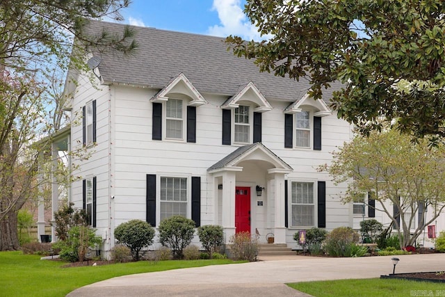 colonial-style house with a shingled roof