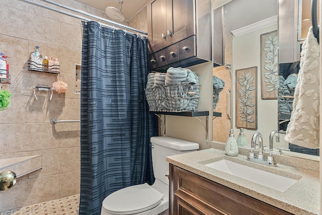 bathroom featuring crown molding, vanity, toilet, and curtained shower