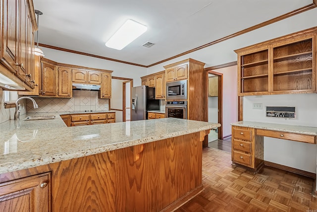 kitchen featuring stainless steel appliances, sink, parquet floors, and kitchen peninsula