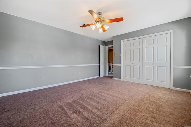 unfurnished bedroom featuring ceiling fan, carpet flooring, and a closet