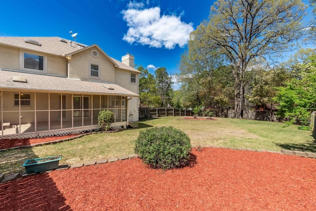 view of yard with a sunroom