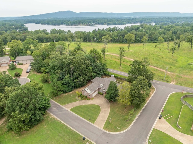 birds eye view of property with a water and mountain view