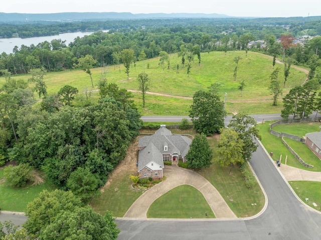 drone / aerial view featuring a water view and a rural view