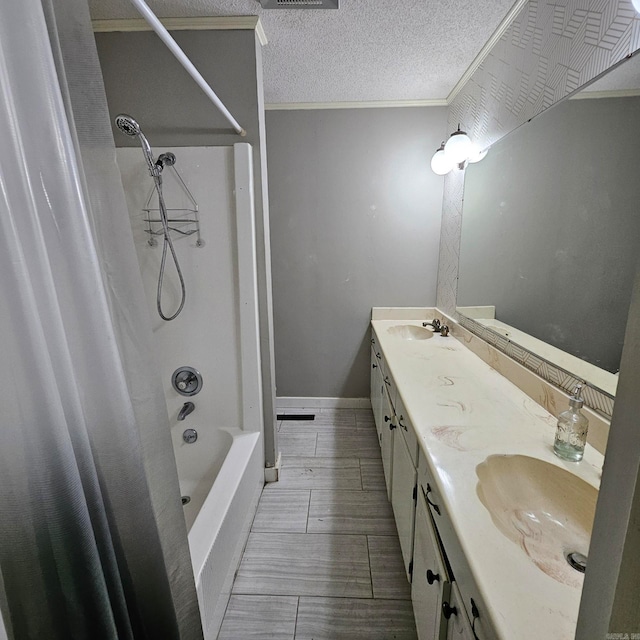 bathroom with shower / bath combination, tile patterned flooring, crown molding, a textured ceiling, and double sink vanity