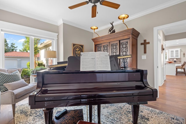 miscellaneous room featuring light hardwood / wood-style flooring and ornamental molding