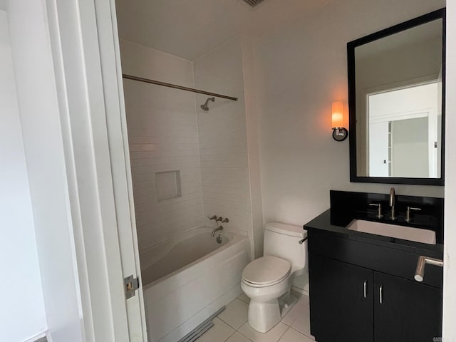 full bathroom featuring tile patterned floors, vanity, tiled shower / bath, and toilet