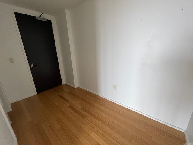 unfurnished room featuring light hardwood / wood-style floors