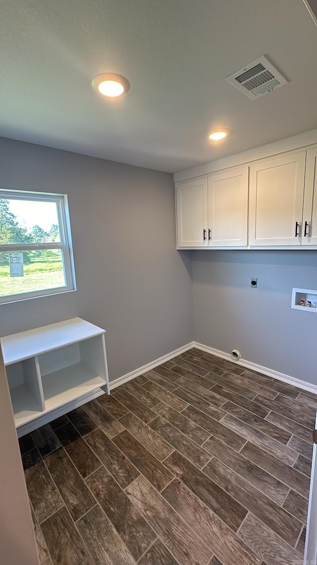 washroom featuring cabinets, hookup for an electric dryer, and hookup for a washing machine