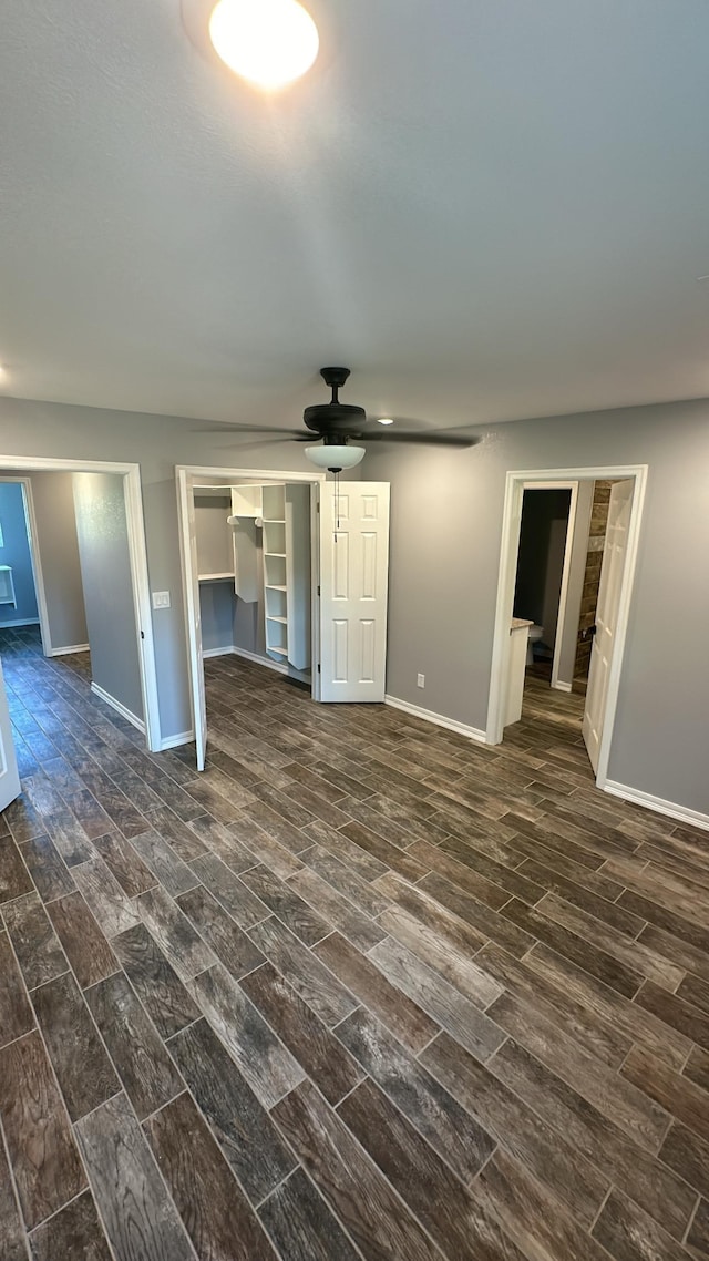 unfurnished living room with ceiling fan