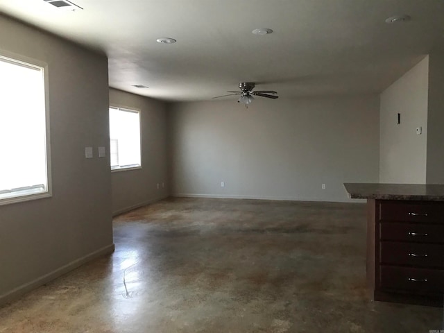 interior space with ceiling fan