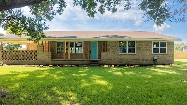 ranch-style home with a front lawn