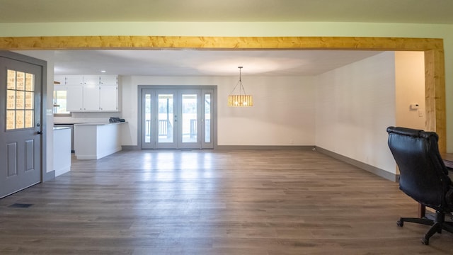 unfurnished dining area featuring dark wood-type flooring