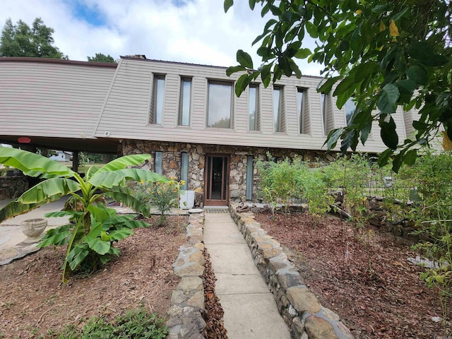 view of front of home with stone siding