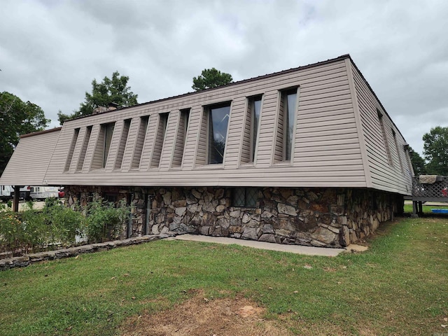 view of home's exterior featuring a yard