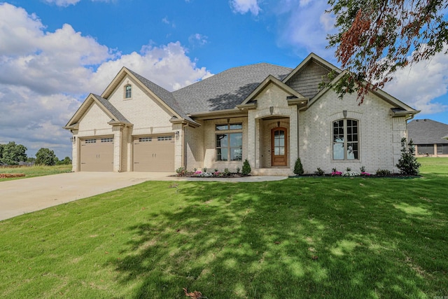 view of front facade with a garage and a front yard