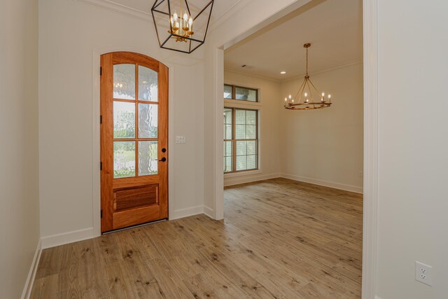 kitchen with white cabinets, stainless steel appliances, wood-type flooring, and light stone counters