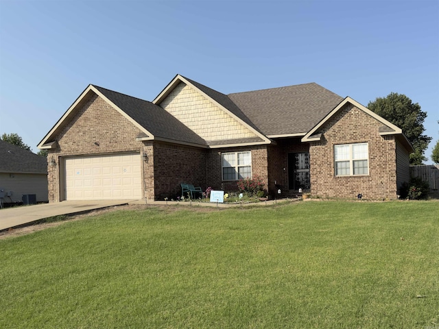 ranch-style home with a garage, a shingled roof, brick siding, driveway, and a front lawn