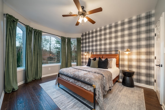 bedroom with ceiling fan and dark hardwood / wood-style flooring