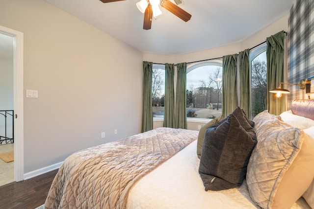 bedroom featuring ceiling fan and dark hardwood / wood-style flooring