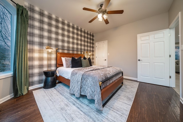 bedroom featuring ceiling fan and dark hardwood / wood-style flooring