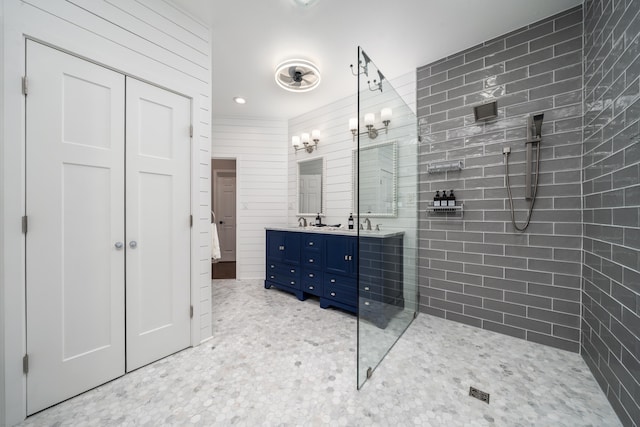 bathroom featuring vanity and tiled shower