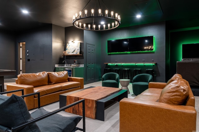 home theater room with a notable chandelier and beverage cooler