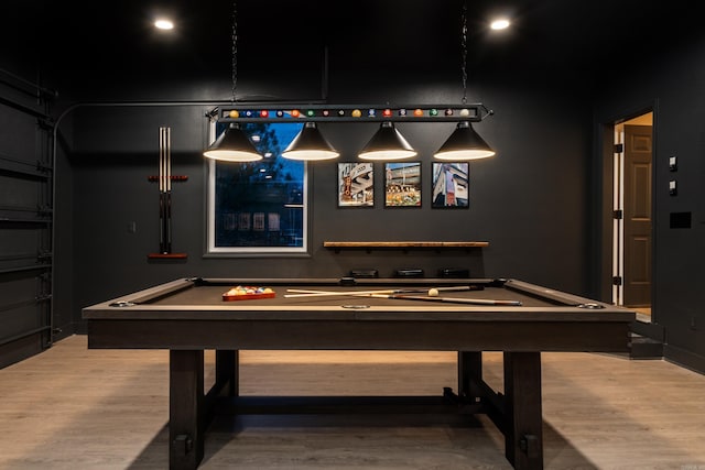 recreation room with hardwood / wood-style floors and billiards