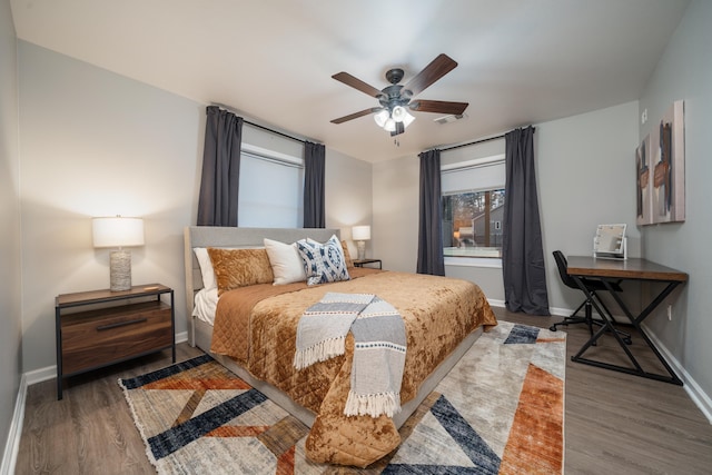 bedroom with hardwood / wood-style flooring and ceiling fan