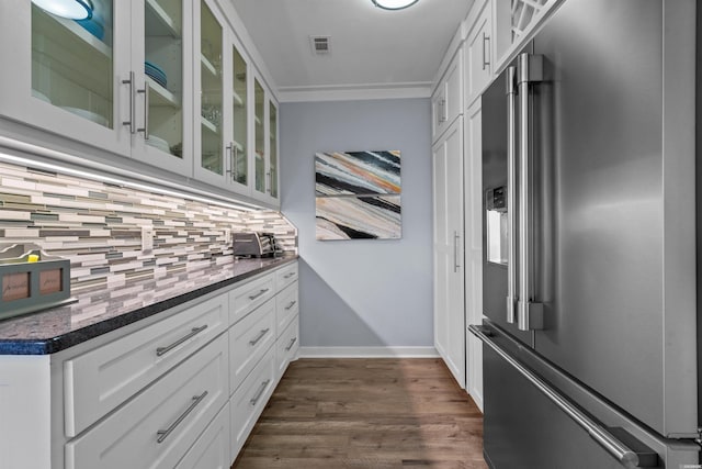 walk in closet featuring dark wood-style flooring and visible vents