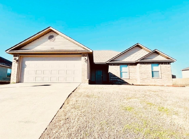 ranch-style home featuring a garage