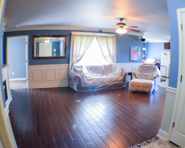 bedroom featuring ceiling fan, hardwood / wood-style flooring, and white refrigerator