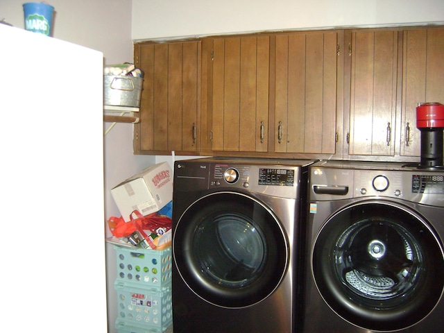 laundry area featuring cabinets and washer and dryer