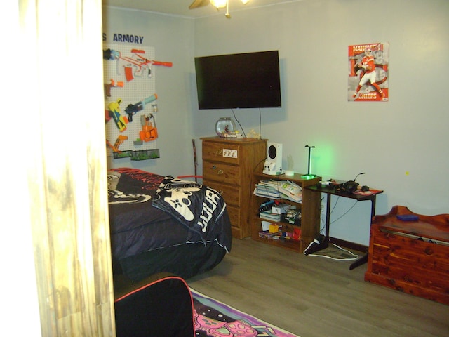 bedroom with wood-type flooring and ceiling fan