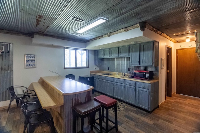 kitchen with wood ceiling and dark hardwood / wood-style flooring