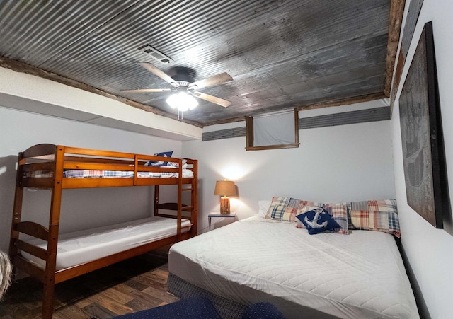 bedroom with hardwood / wood-style flooring and ceiling fan