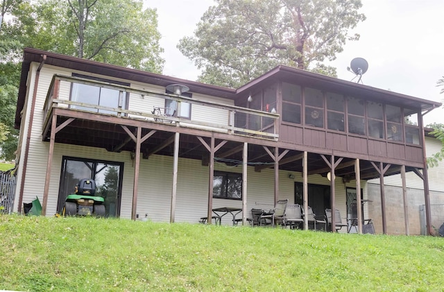 rear view of house with a yard