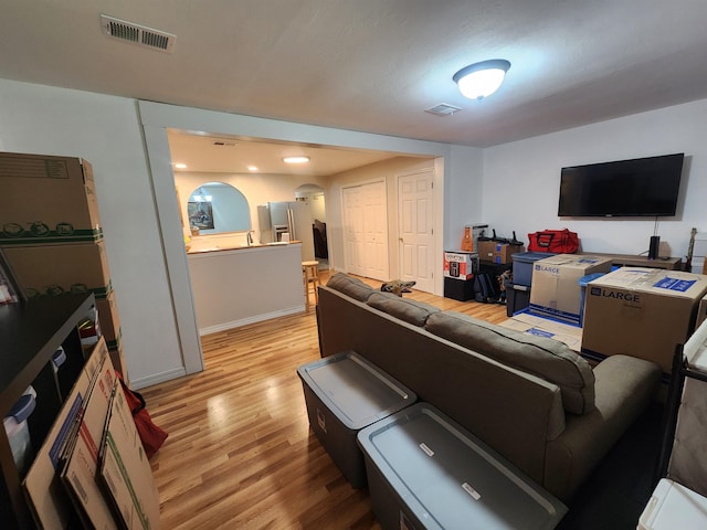 living room with light hardwood / wood-style floors