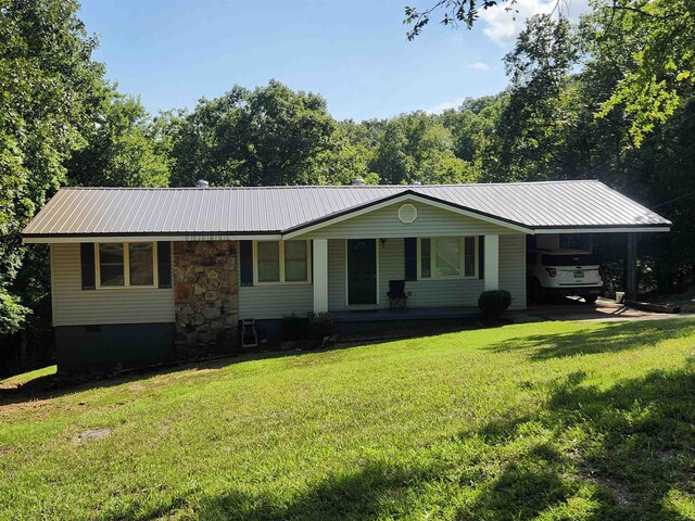 single story home with a carport and a front yard